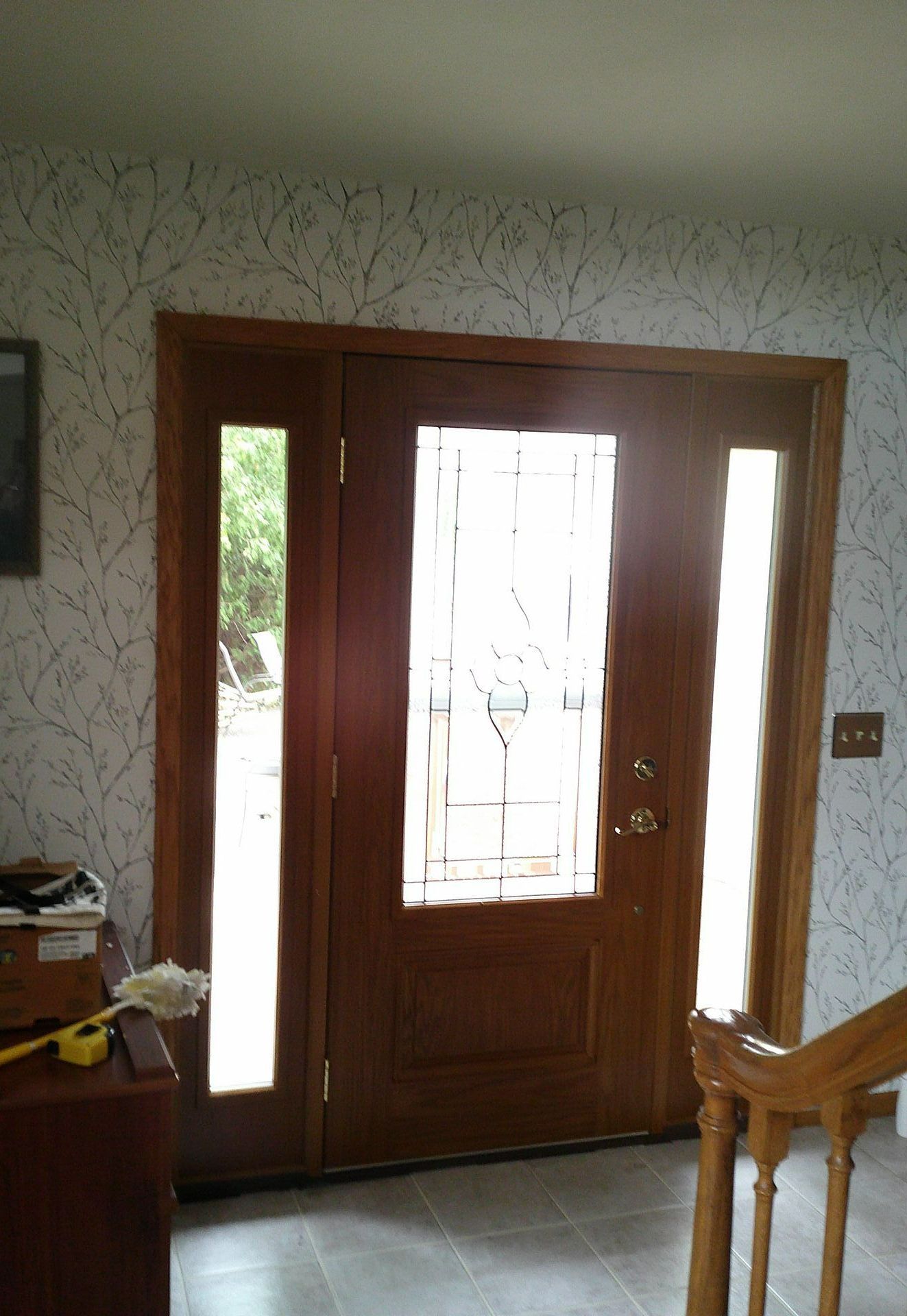 A wooden door with a stained glass window