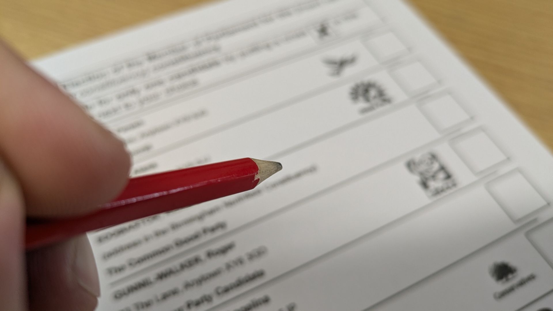 A ballot paper from the election with a pencil about to mark the vote