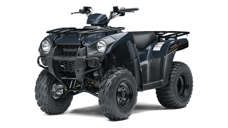 A black atv is sitting on top of a white surface.