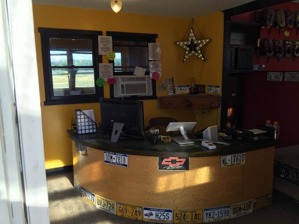 A counter in a room with a lot of license plates on it