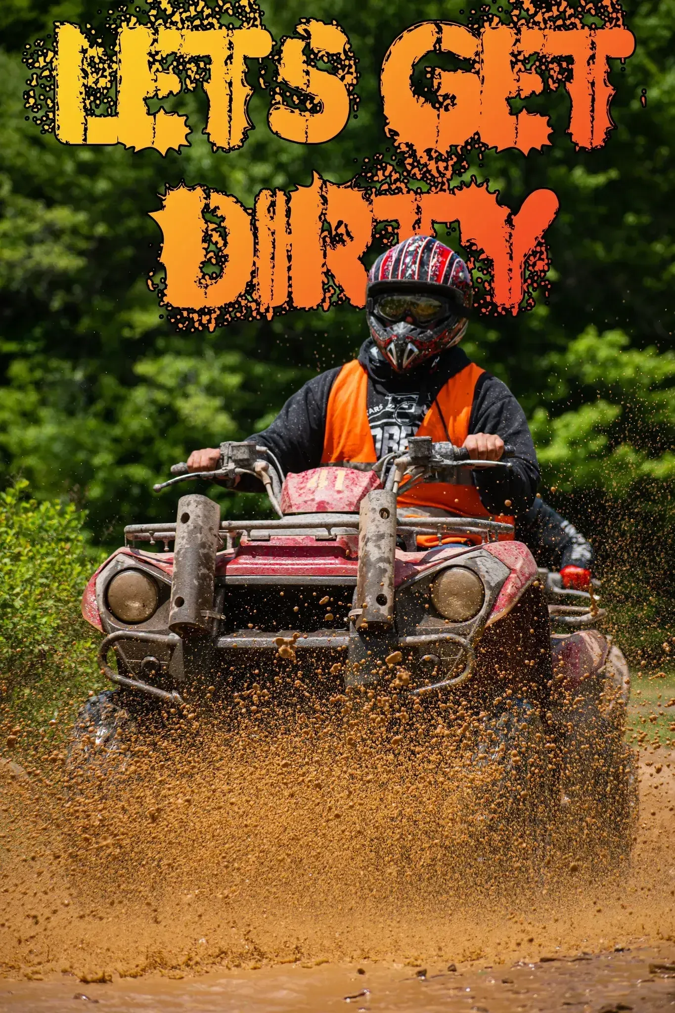 A man is riding a four wheeler through the mud.