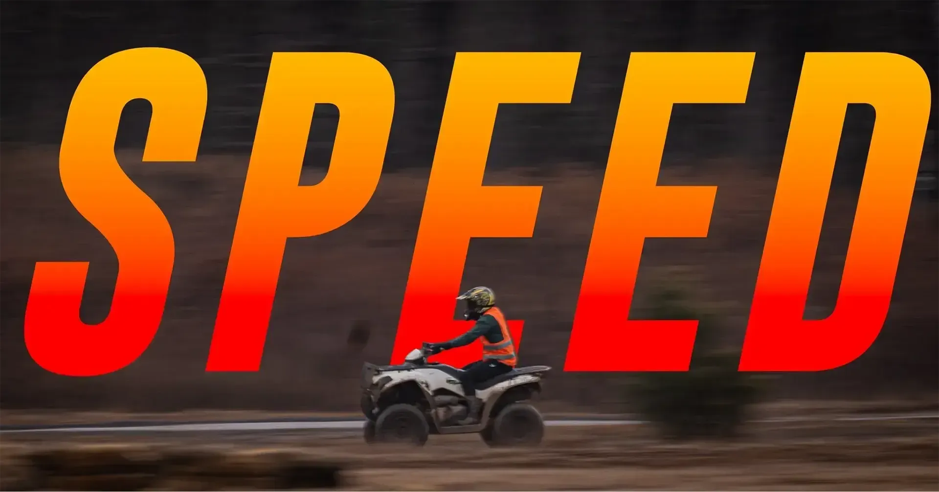 A person is riding a four wheeler with the word speed behind them