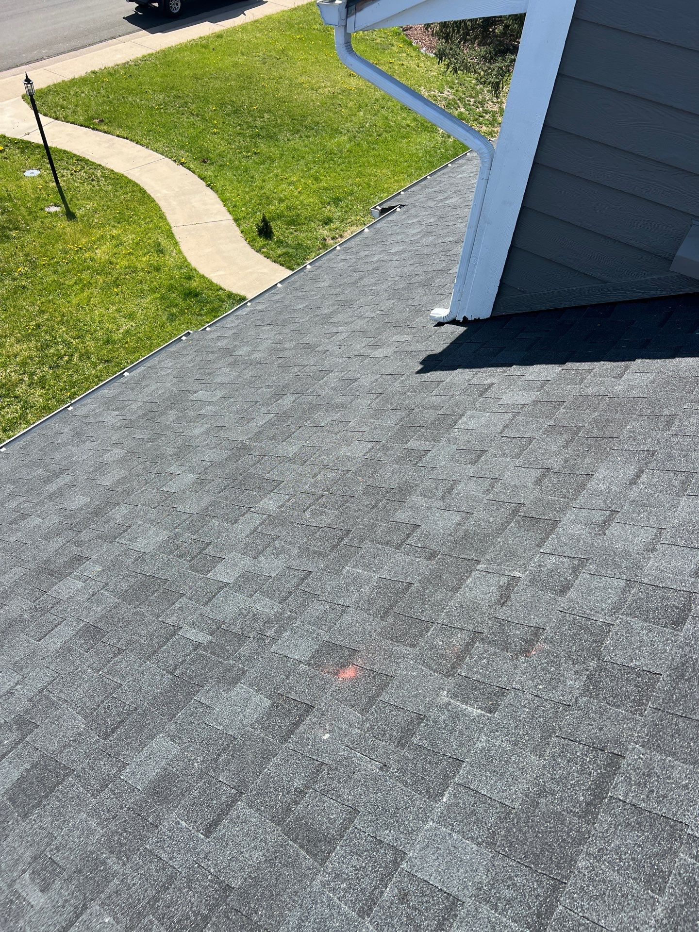 A roof of a house with a gutter on it.