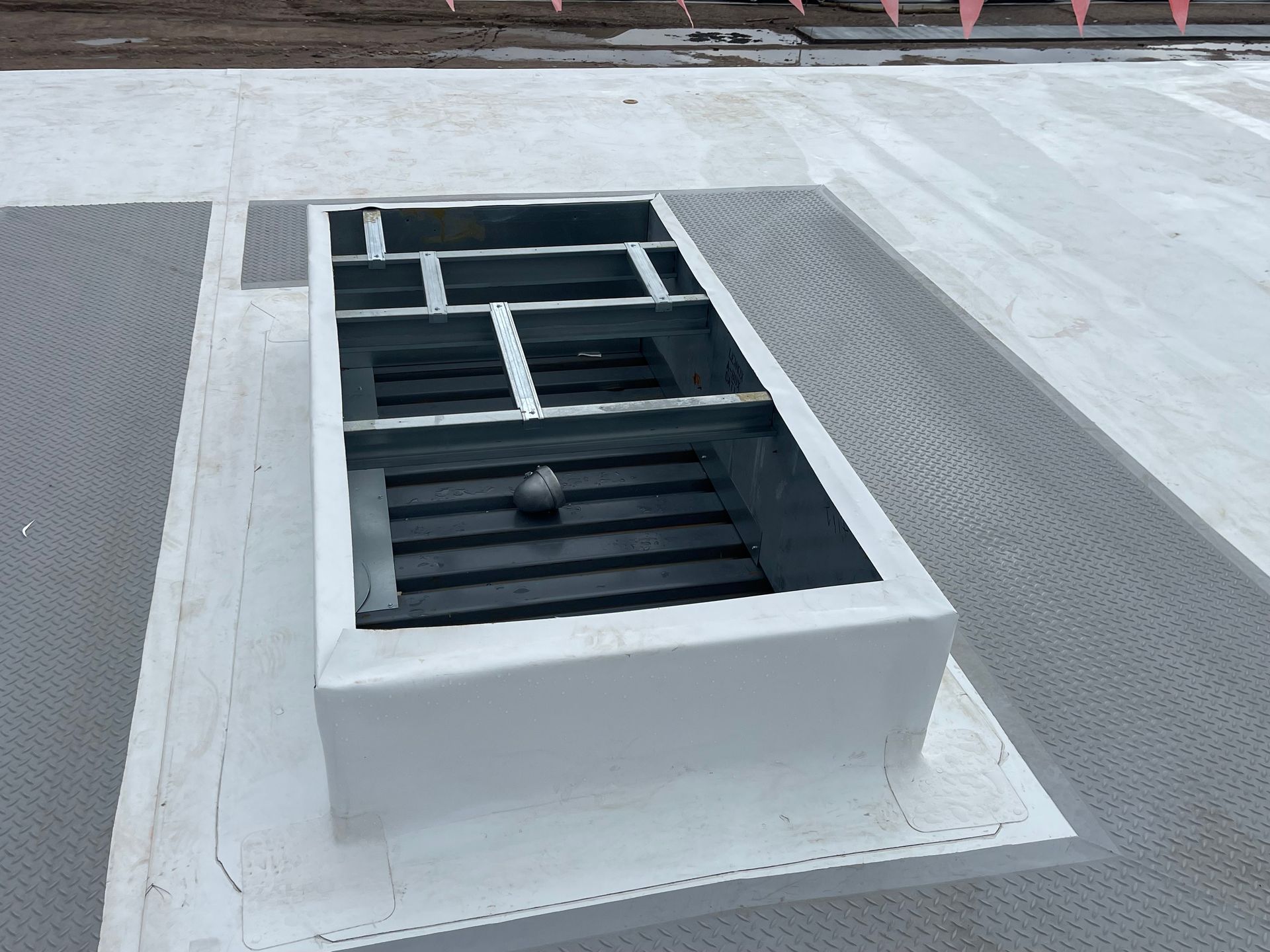 A white building with a window on the side