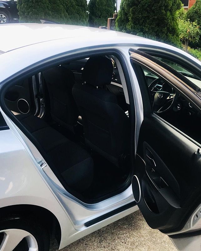 The Inside of a White Car With the Door Open — Shine Your Ride In Karabar, NSW