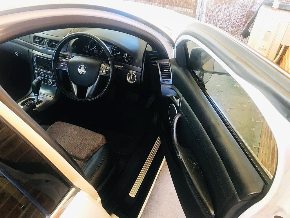 The Inside of a White Car With the Door Open — Shine Your Ride In Karabar, NSW
