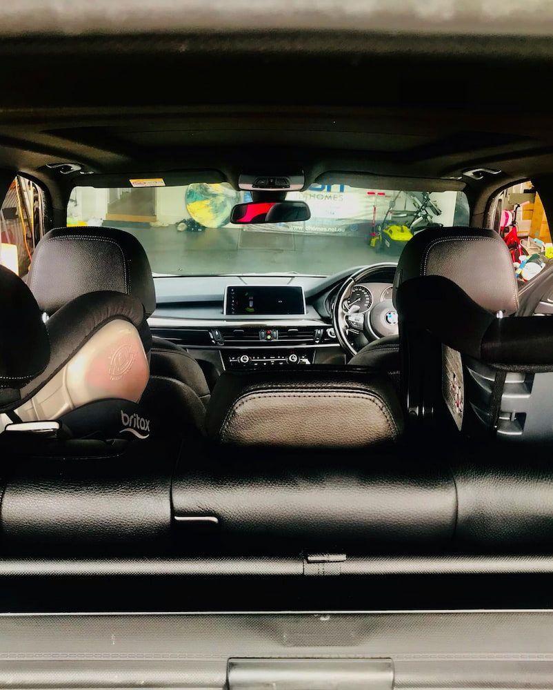 The Back Seat Of A Car With A Child Seat In It — Shine Your Ride In Bungendore, NSW