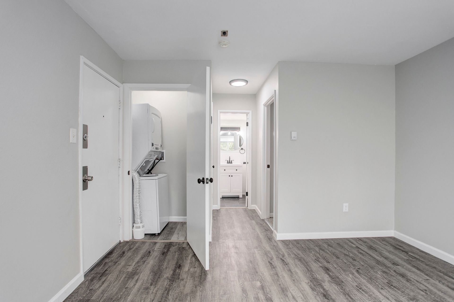 there is a laundry room in the middle of the room .