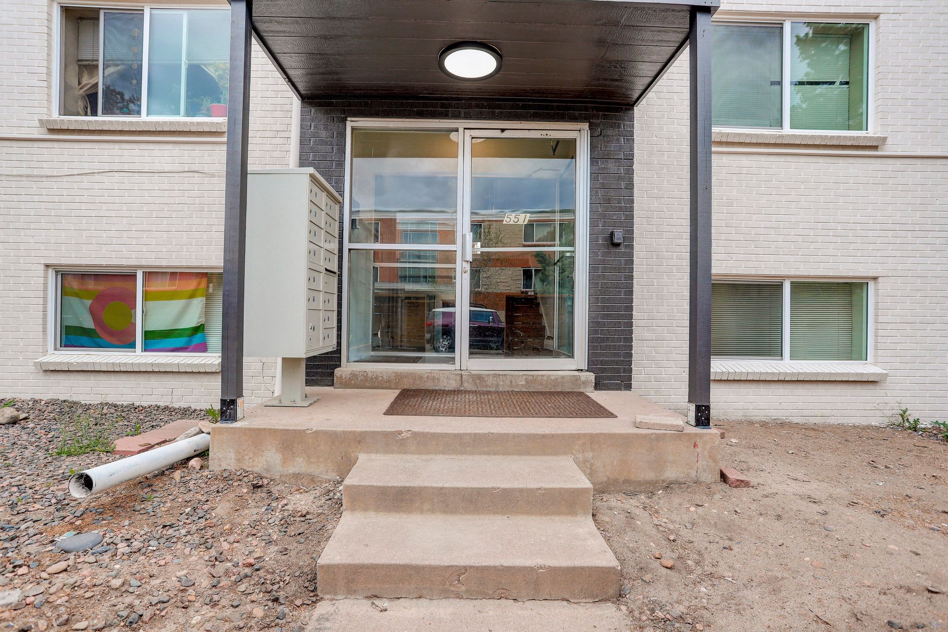 the entrance to a building with stairs leading up to it .