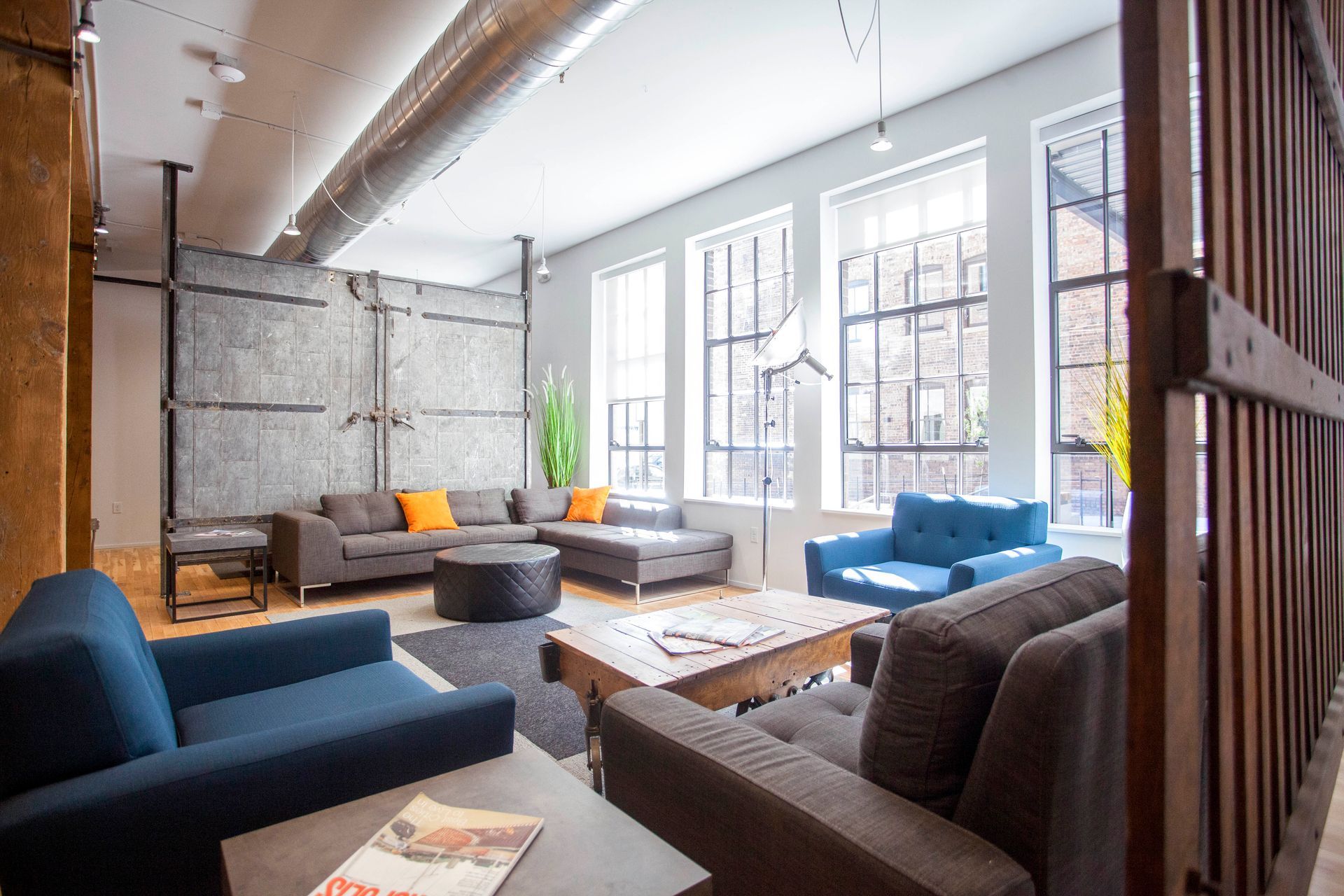 a living room filled with furniture and a magazine on a table .