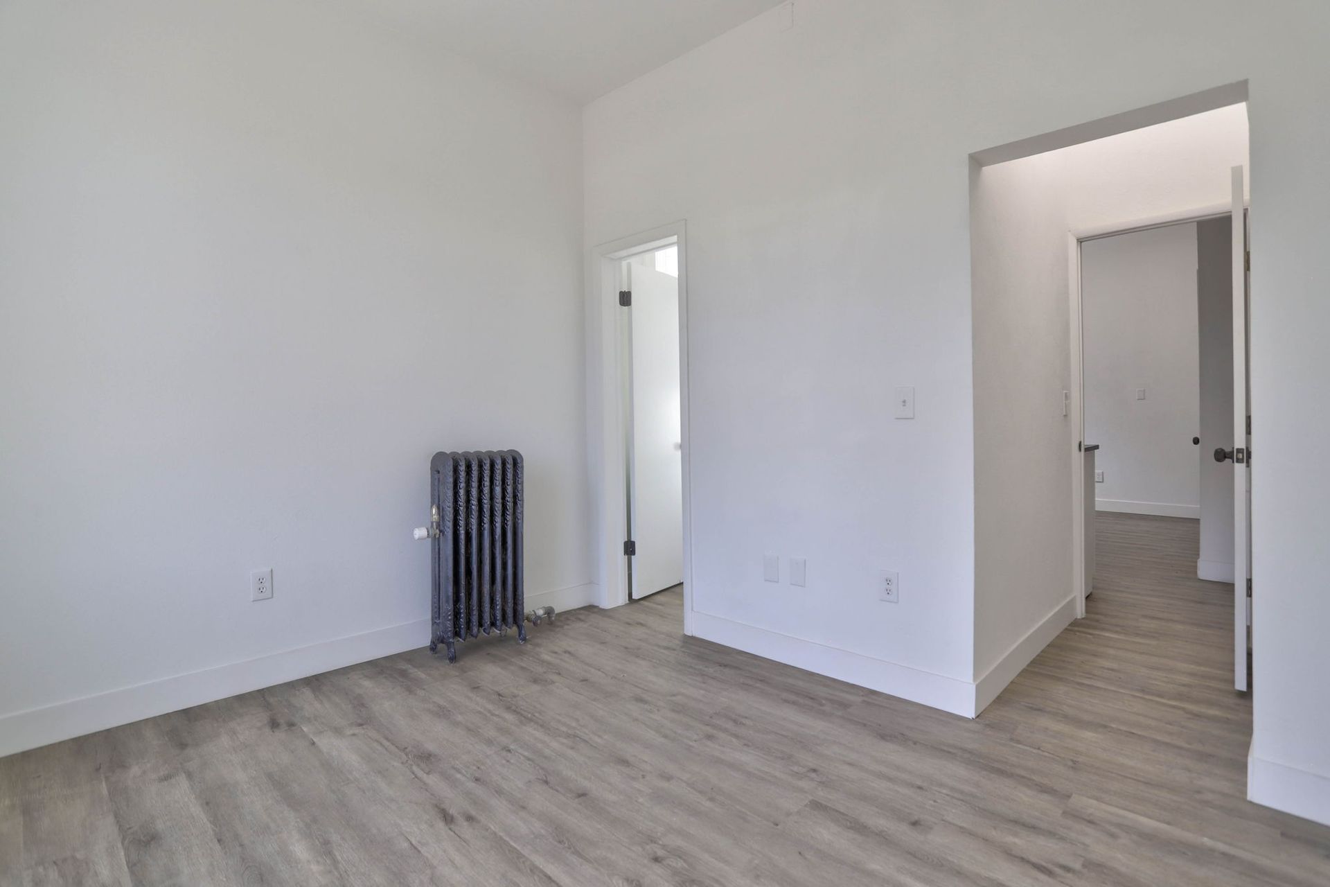 there is a radiator in the middle of the room .