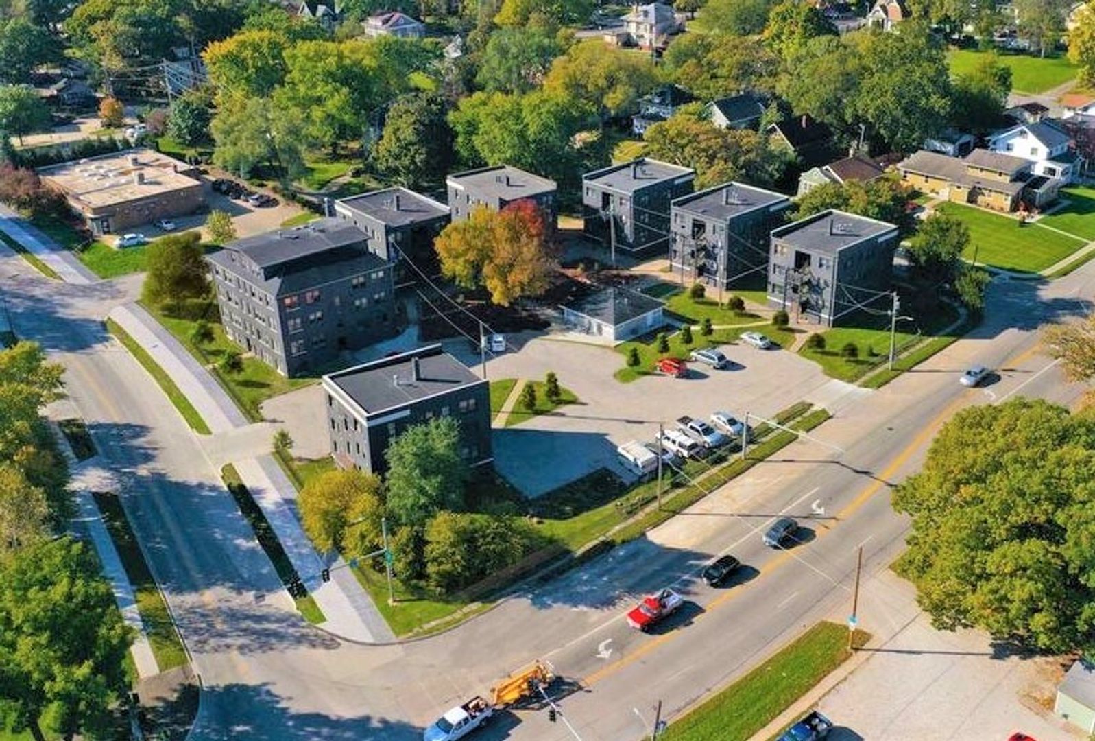 an aerial view of a residential area with lots of buildings and trees