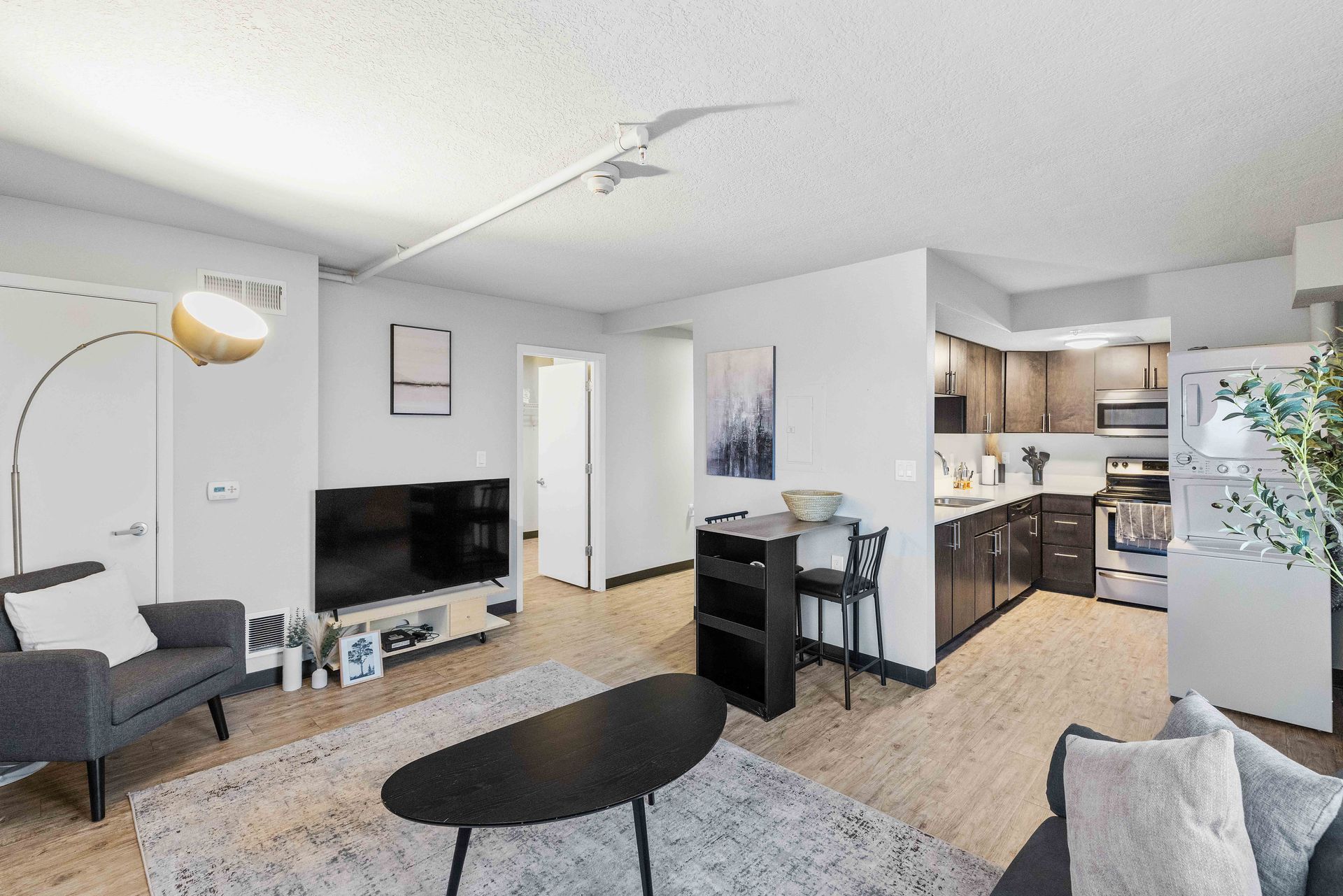 a living room filled with furniture and a flat screen tv .