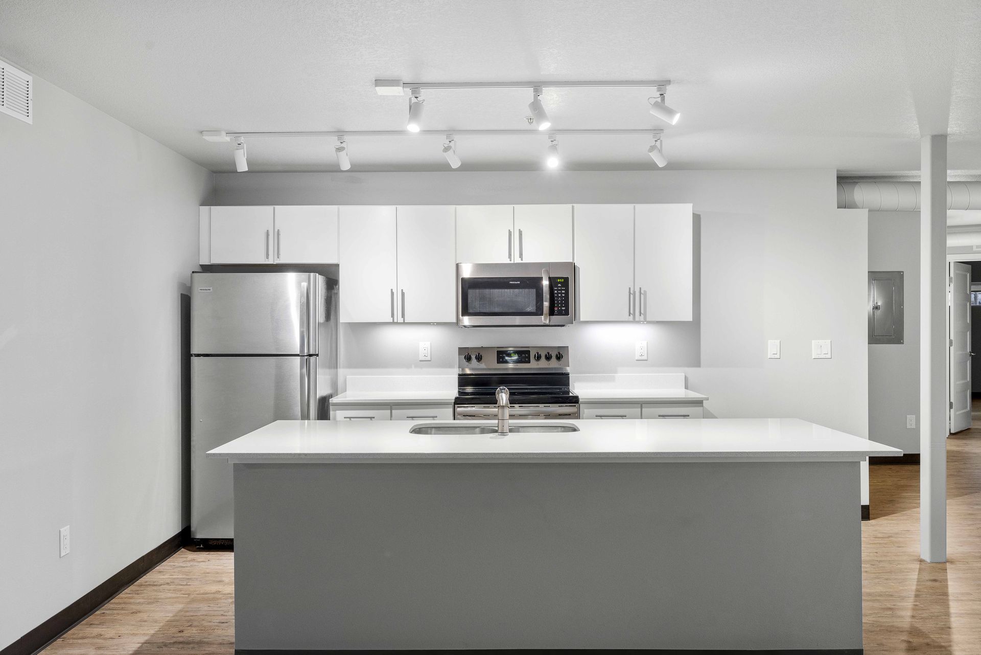 a kitchen with a large island in the middle of the room .