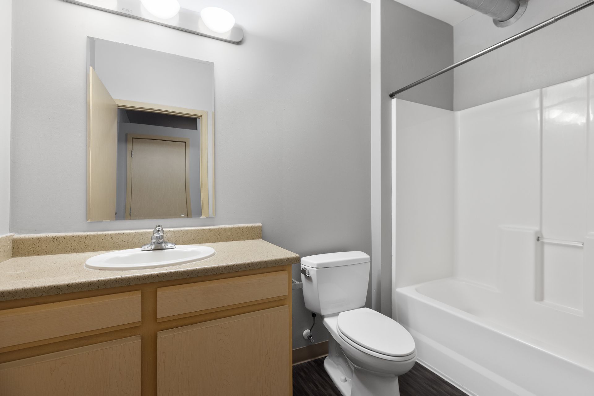 a bathroom with a toilet , sink , and bathtub .