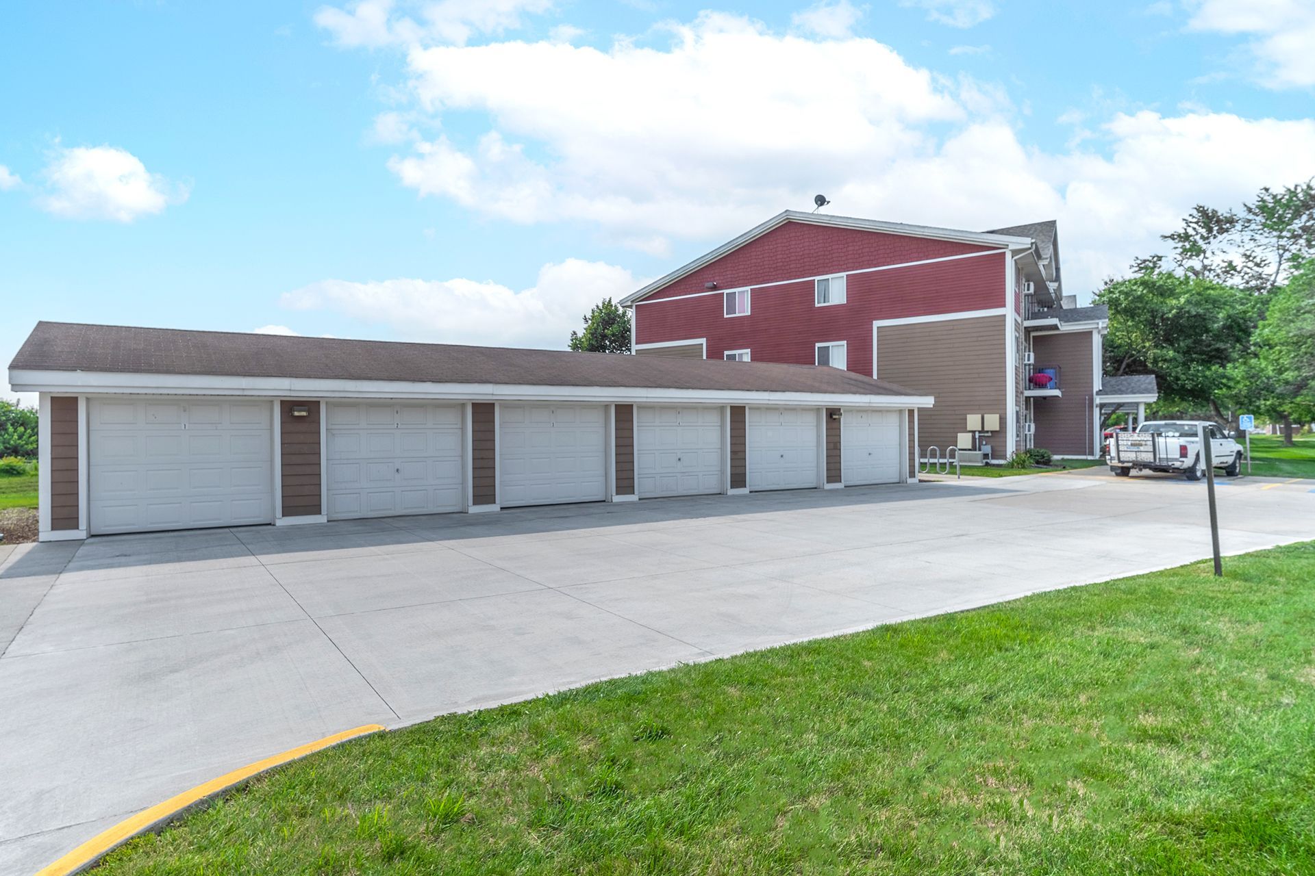 a building with a lot of garages in front of it .