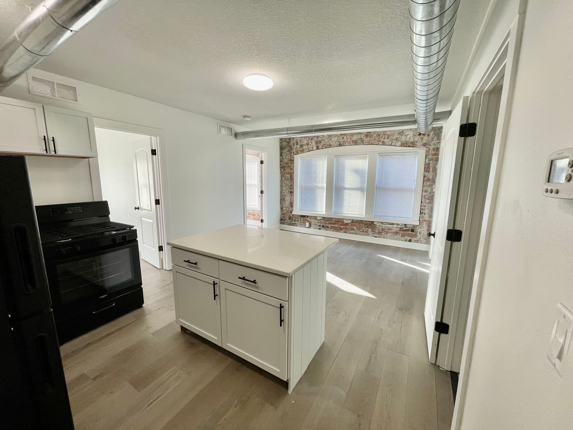 a kitchen with a large island in the middle of the room .