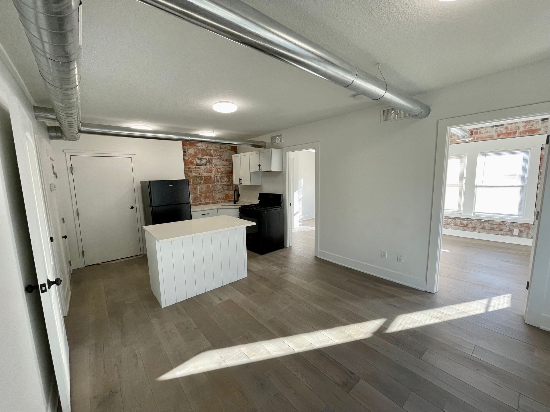 a kitchen with a large island in the middle of the room .