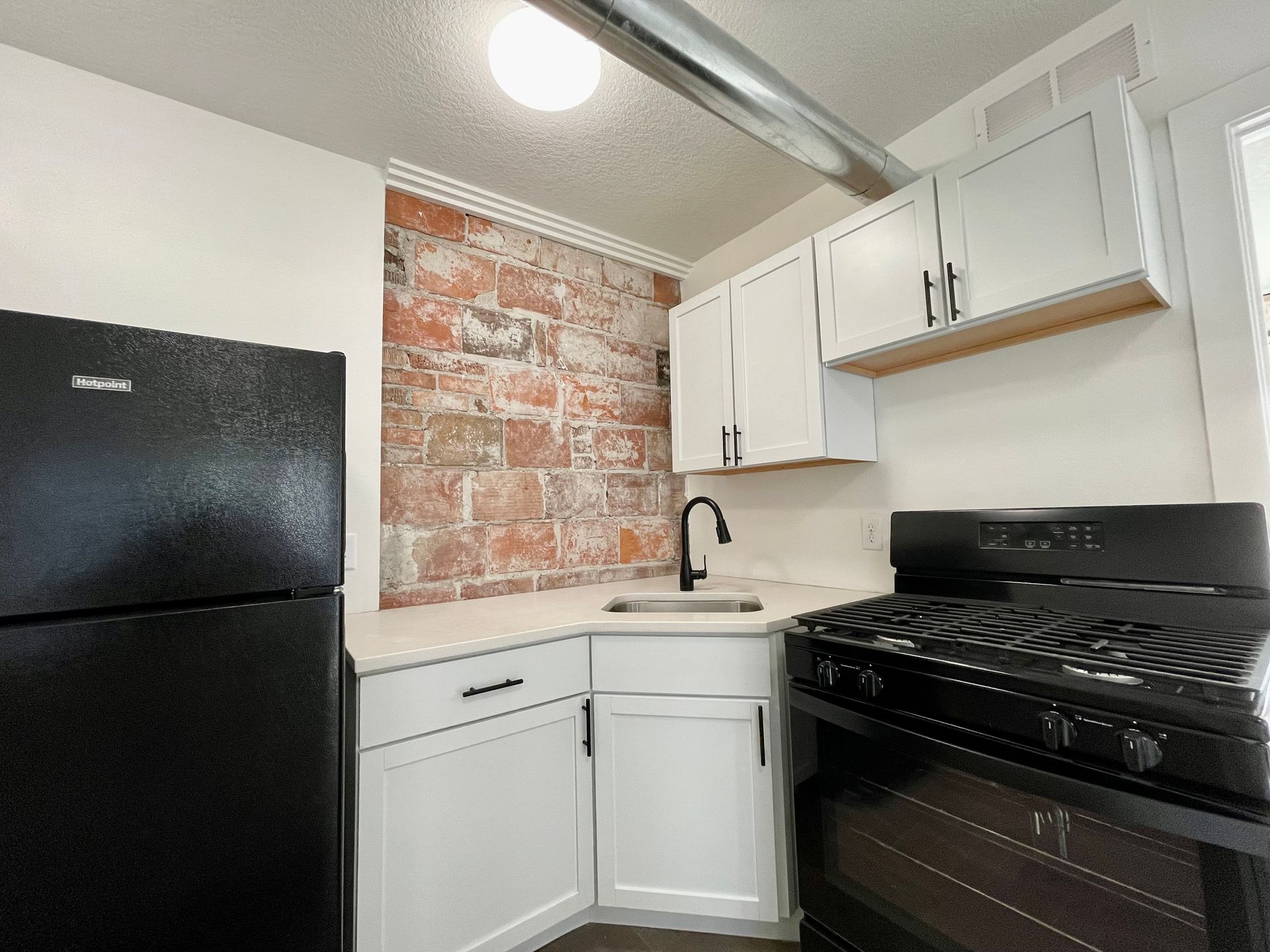 a kitchen with a large island in the middle of the room .