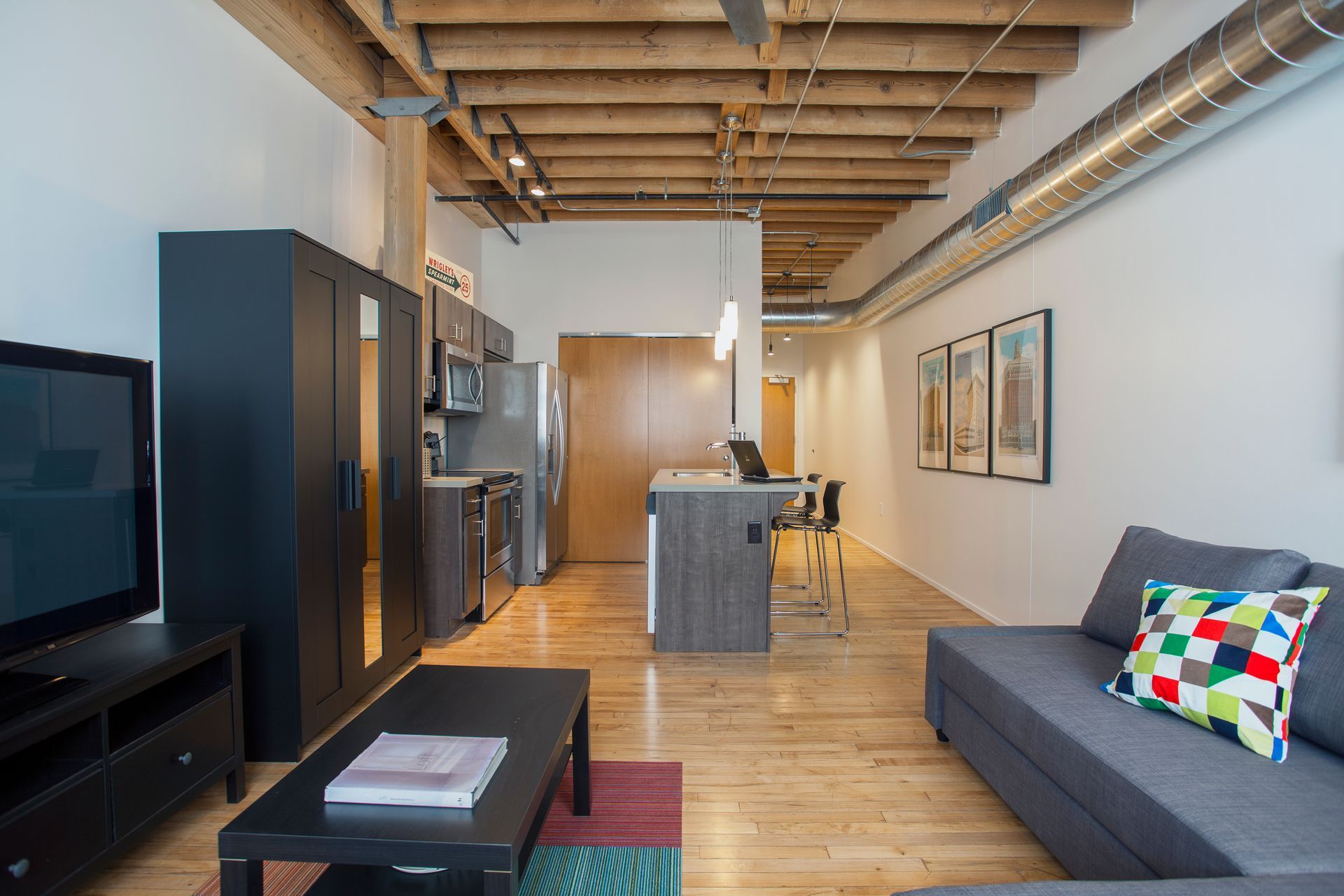 a living room with a couch and a flat screen tv