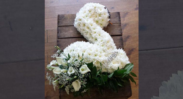 Funeral  flowers arrangement  -swan