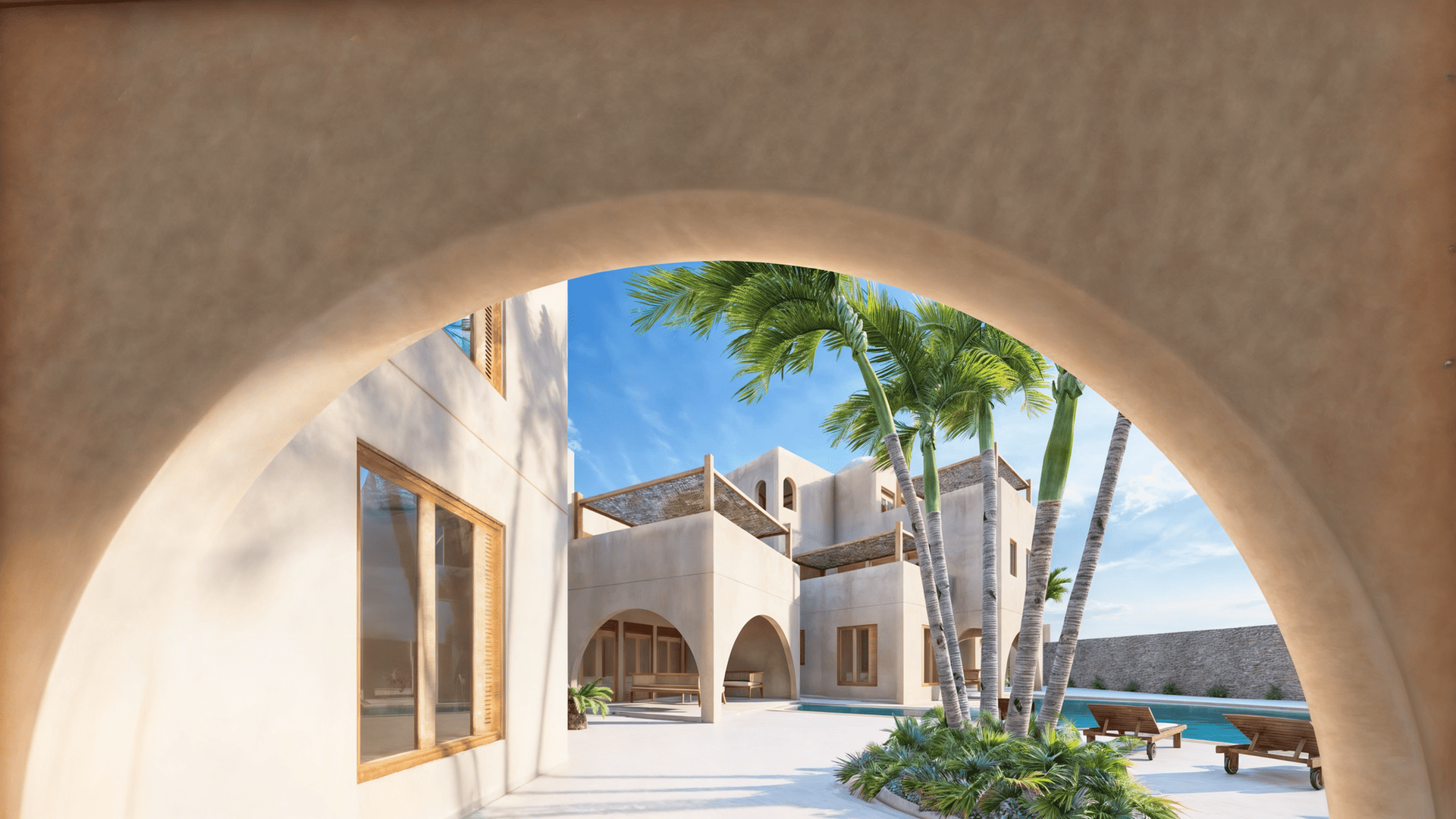 Exterior view of an elegant villa with white walls and wooden details, surrounded by tropical greenery.