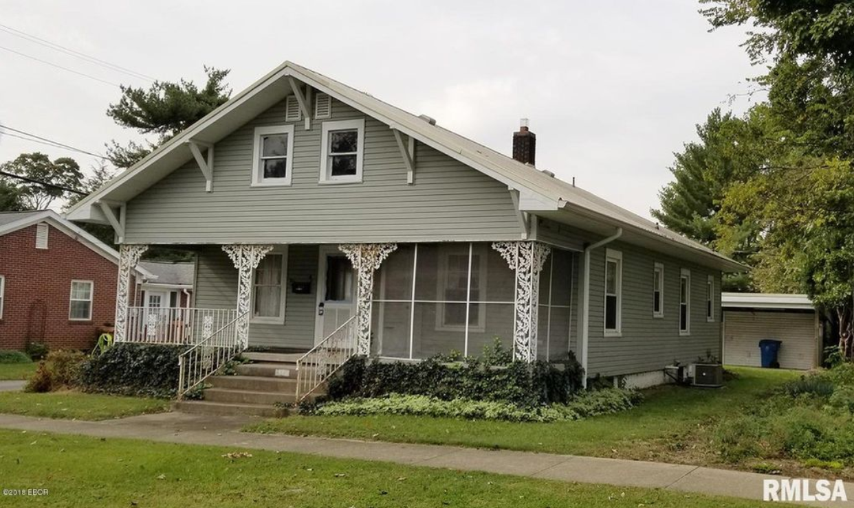 A house with a screened in porch is for sale