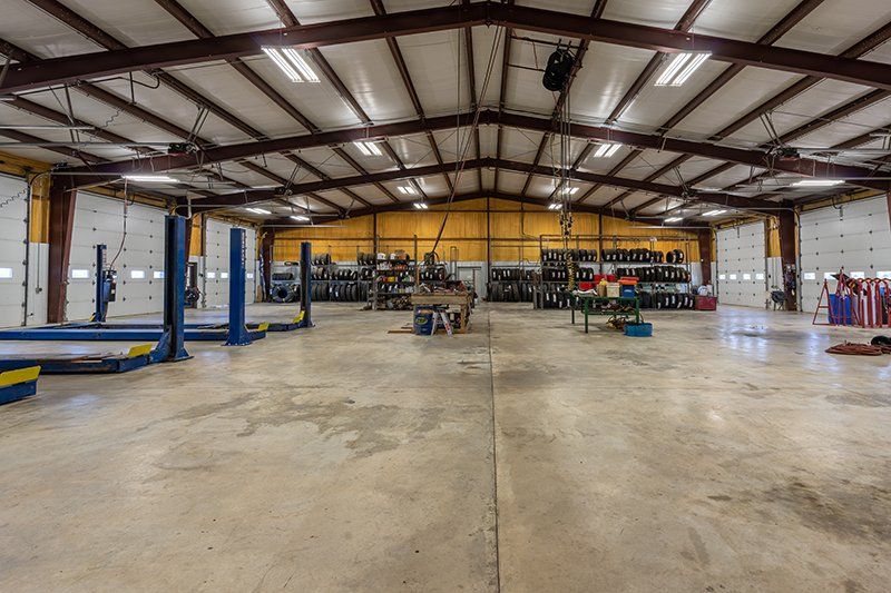 A large warehouse with a lot of machinery in it.