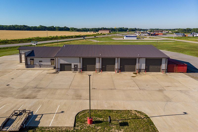 An aerial view of a large building with a lot of garage doors.