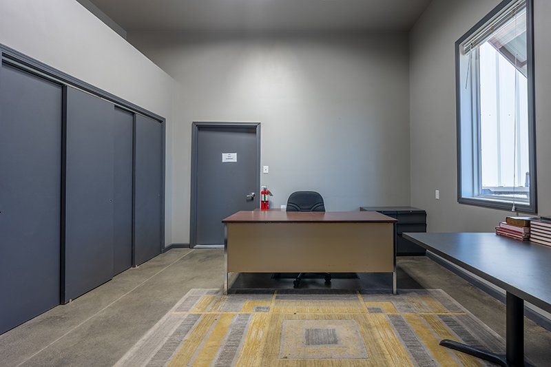 There is a desk in the middle of the room.