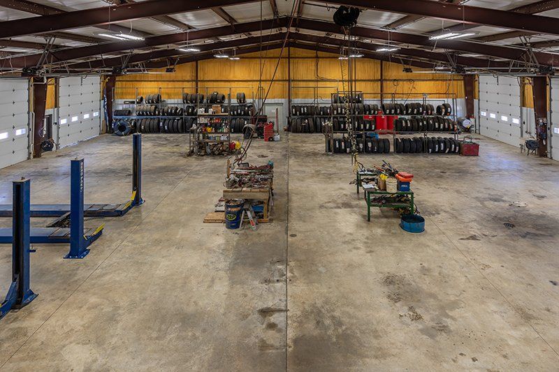 A large warehouse with a lot of tools and equipment in it.