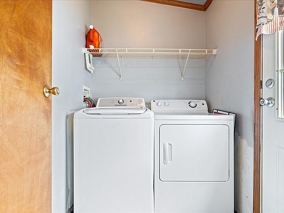 A laundry room with a washer and dryer in it.