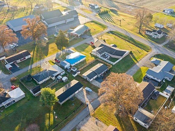 An aerial view of a residential area with lots of houses and trees.