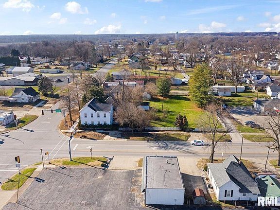 An aerial view of a small town with a lot of houses and trees.