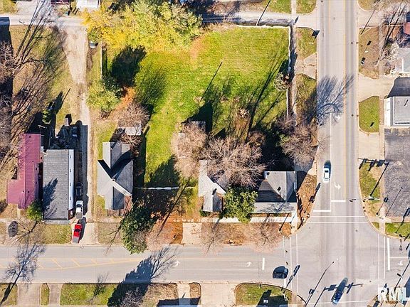 An aerial view of a residential area with a lot of houses and trees.