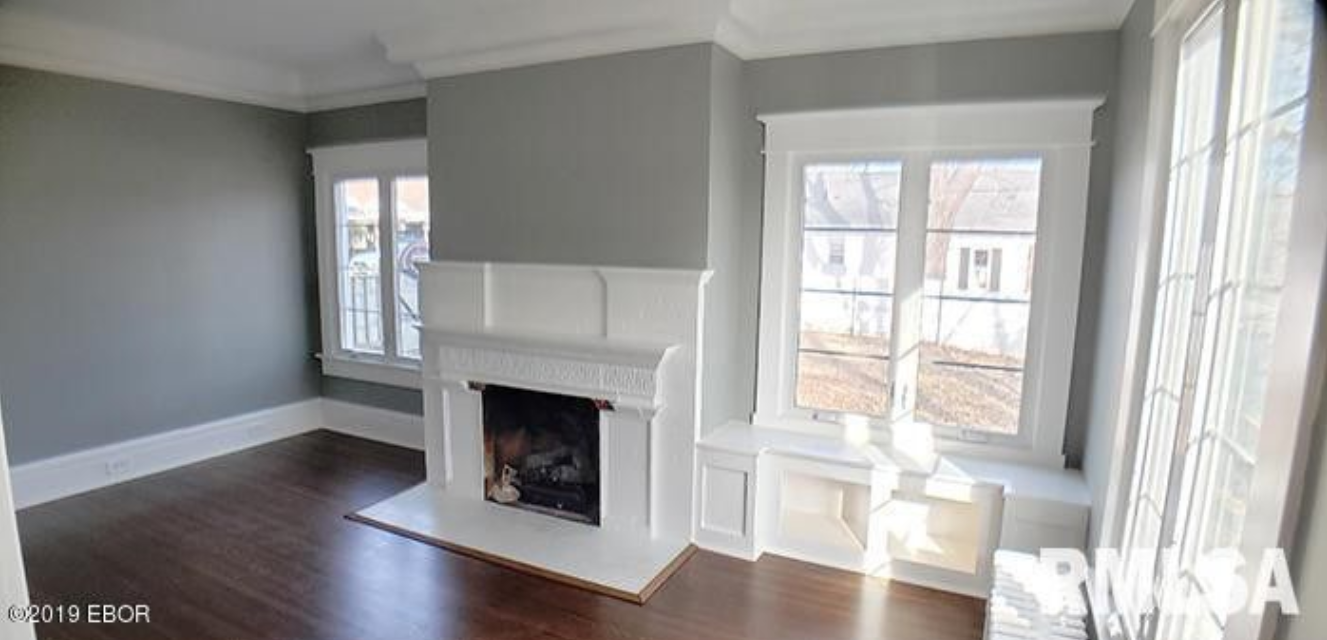 There is a fireplace in the middle of the room.