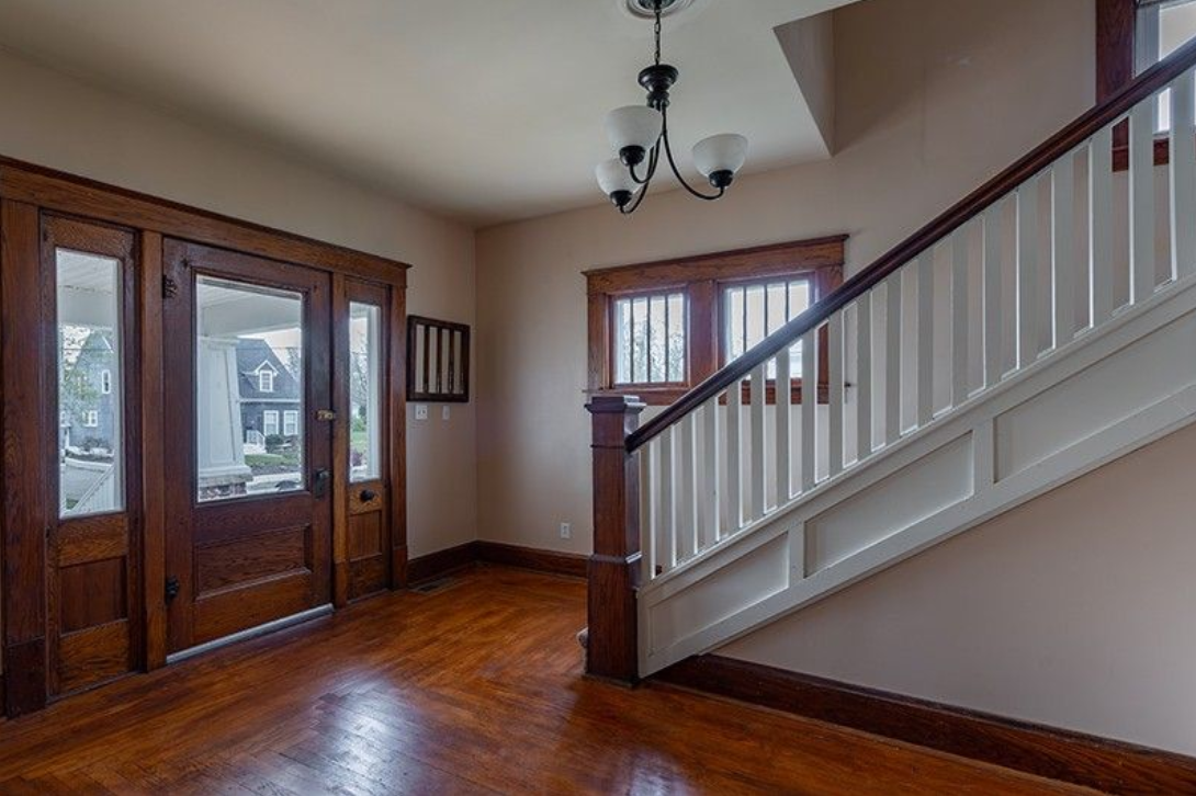 There is a staircase leading up to the second floor of a house.