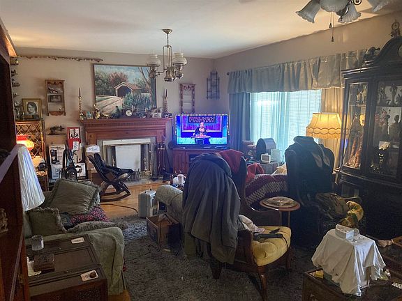 A living room filled with furniture and a television.