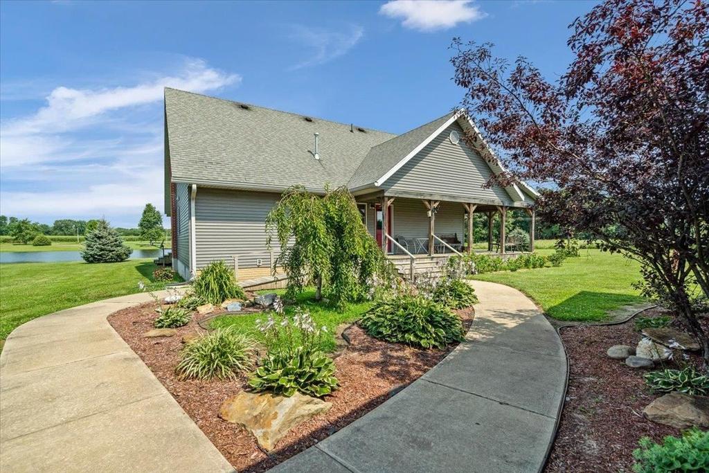 A house with a concrete walkway leading to it