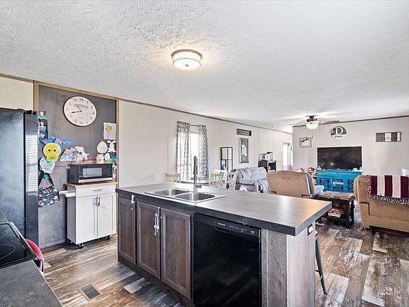 A kitchen with a large island in the middle of the room.