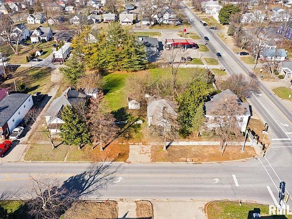 An aerial view of a residential area with a lot of houses and trees.