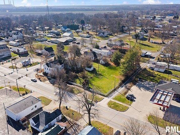 An aerial view of a small town with lots of houses and trees.