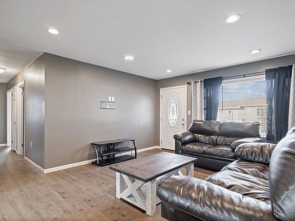 A living room with a couch and a coffee table.