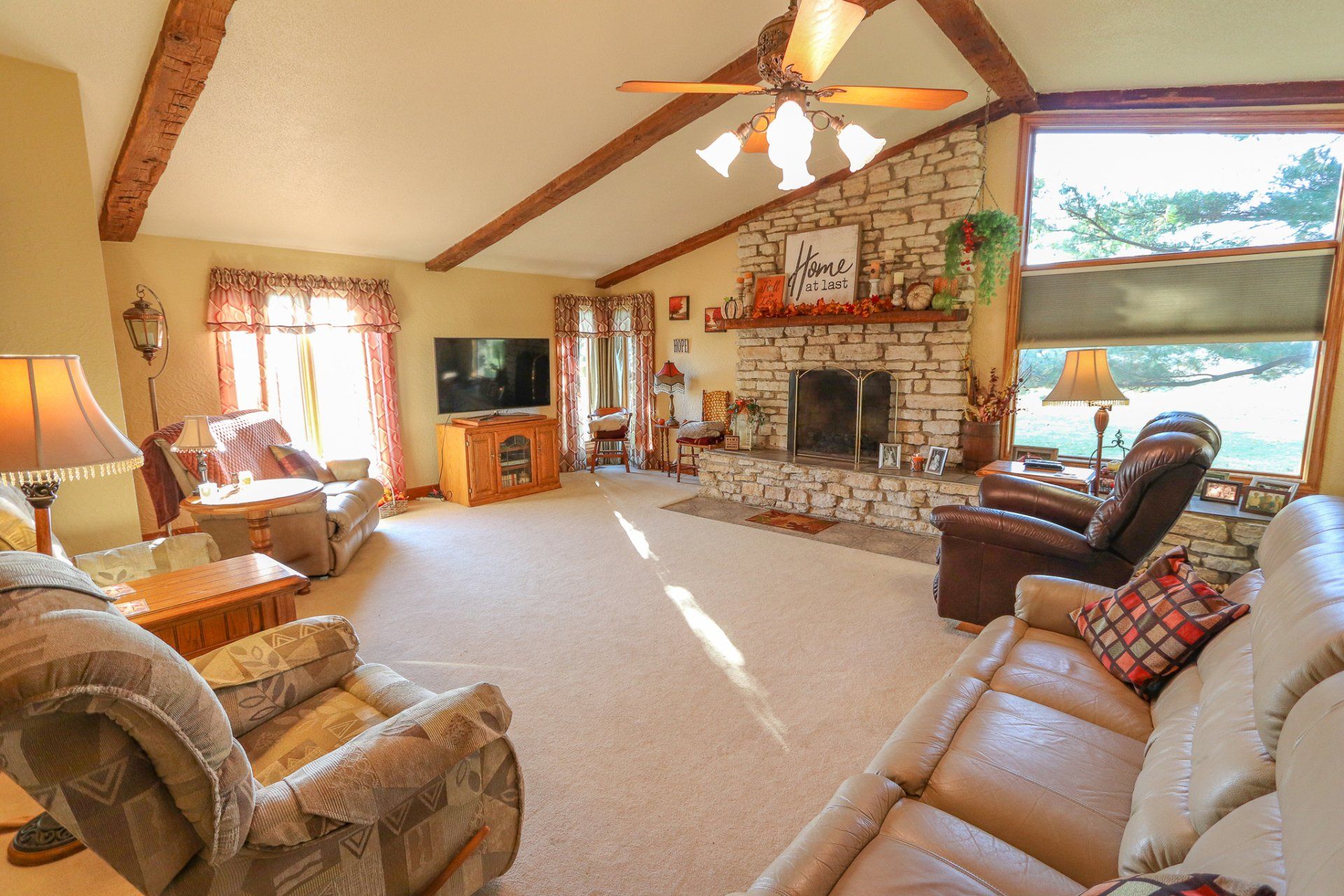 A living room filled with furniture and a fireplace