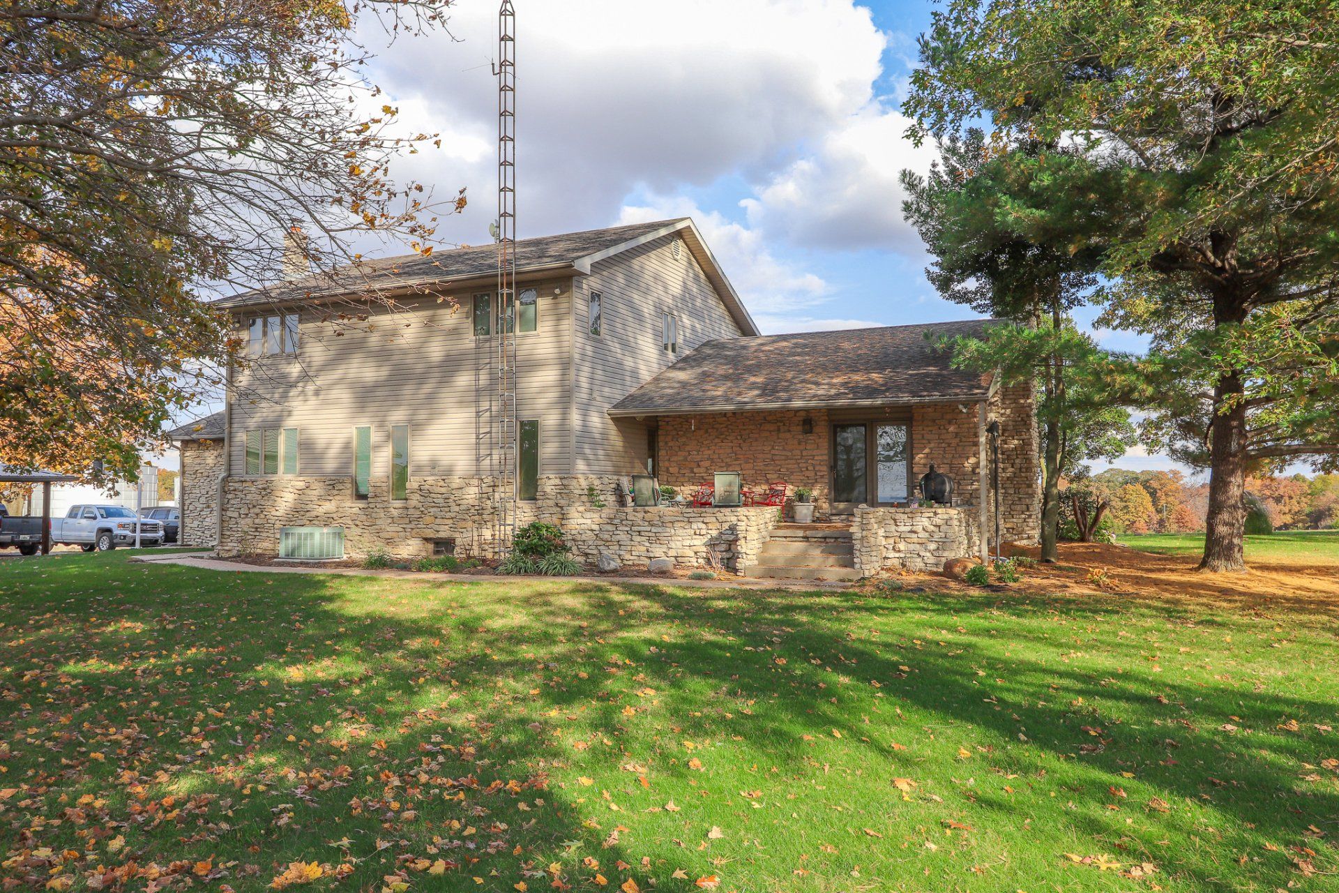 A large house with a large lawn in front of it.
