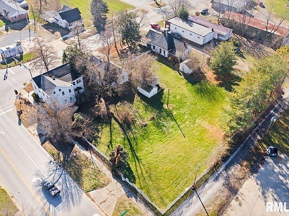 An aerial view of a residential area with a lot of houses and trees.