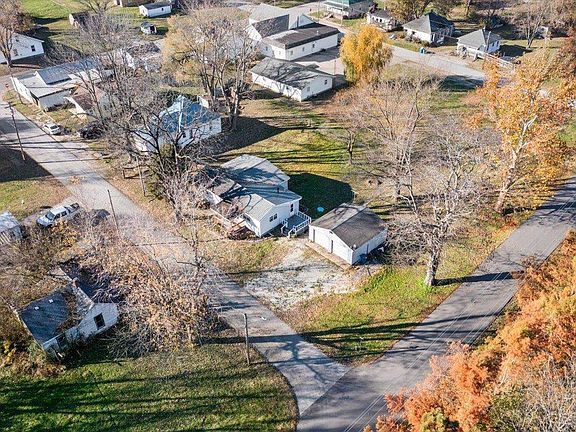 An aerial view of a small town with a lot of houses and trees.