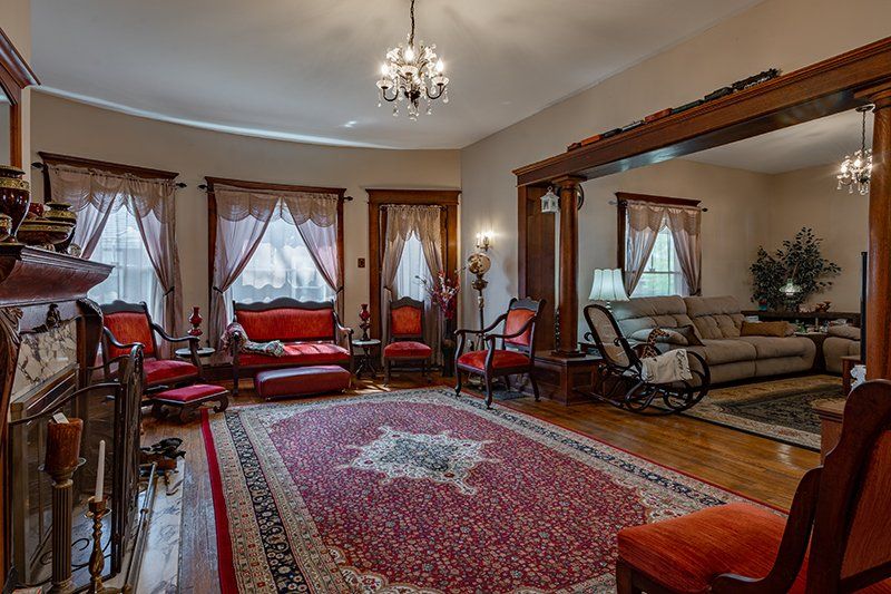 A living room filled with furniture and a fireplace.