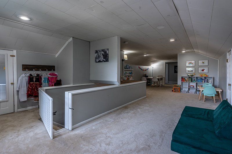 There is a couch in the middle of the room.