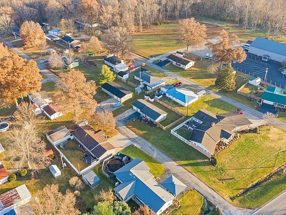 An aerial view of a residential neighborhood with lots of houses and trees.